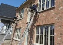 Workers doing exterior calking